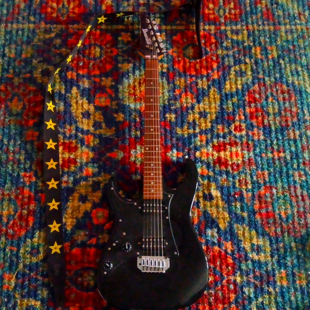 Left handed electric guitar with strap